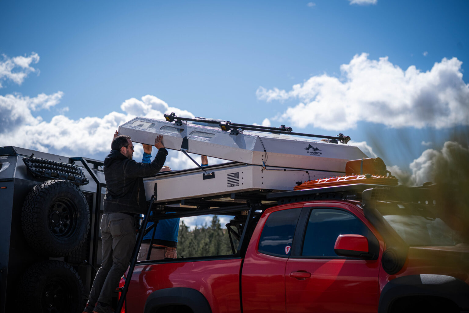Hardsided Rooftop Tent concept being deployed