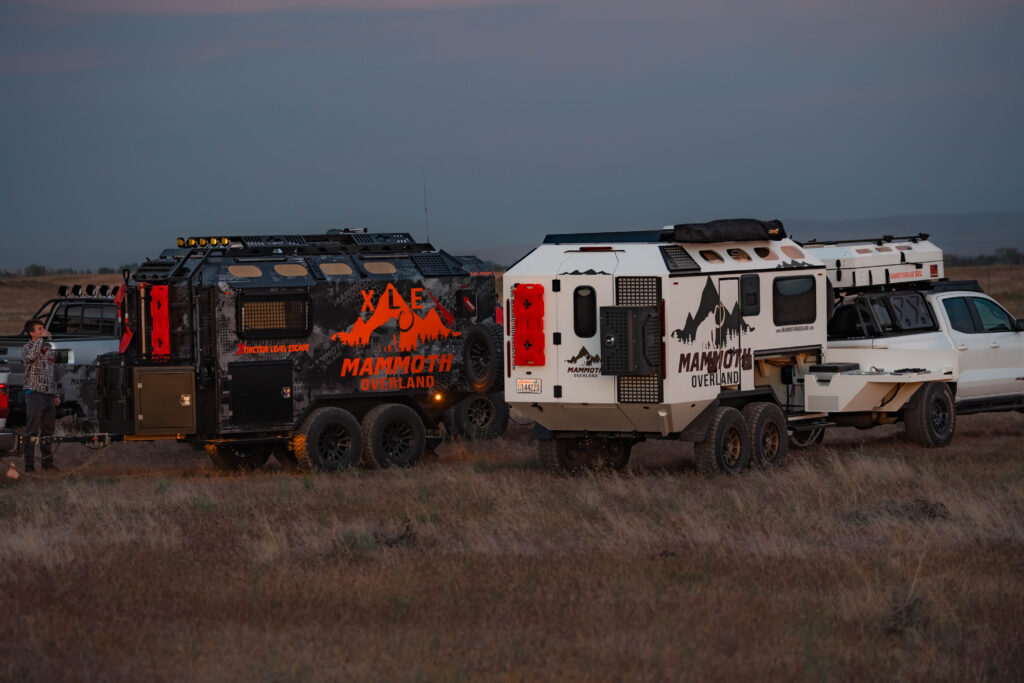 Mammoth Overland XLE and TL off-road trailers parked together at dusk, showing aerospace-grade aluminum construction and off-road tires"